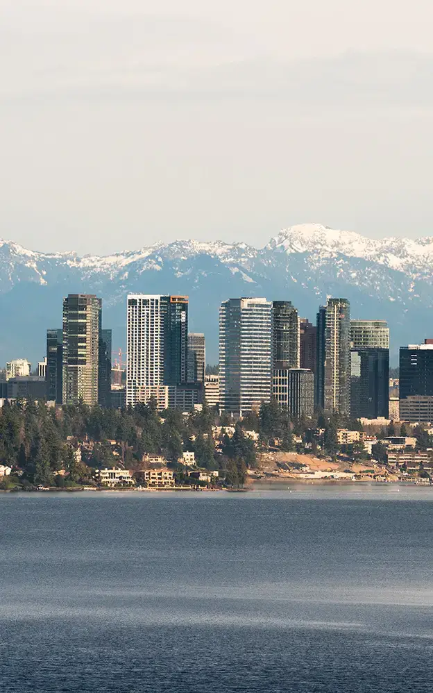 Downtown Bellevue Washington with snow on mountains in background