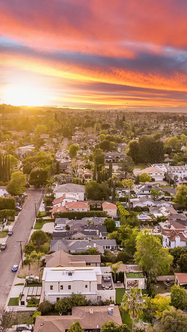 Community aerial with skyline sunset